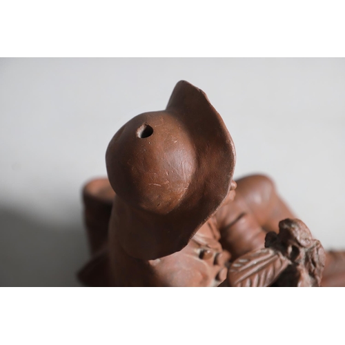 908 - A 19TH CENTURY FRENCH TERRACOTTA GROUP. modelled as a courting couple, seated upon naturalistic base... 