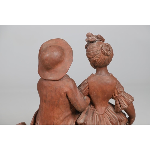 908 - A 19TH CENTURY FRENCH TERRACOTTA GROUP. modelled as a courting couple, seated upon naturalistic base... 