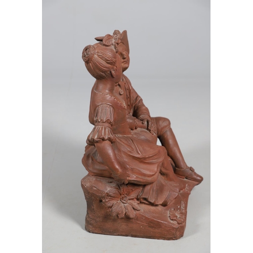 908 - A 19TH CENTURY FRENCH TERRACOTTA GROUP. modelled as a courting couple, seated upon naturalistic base... 