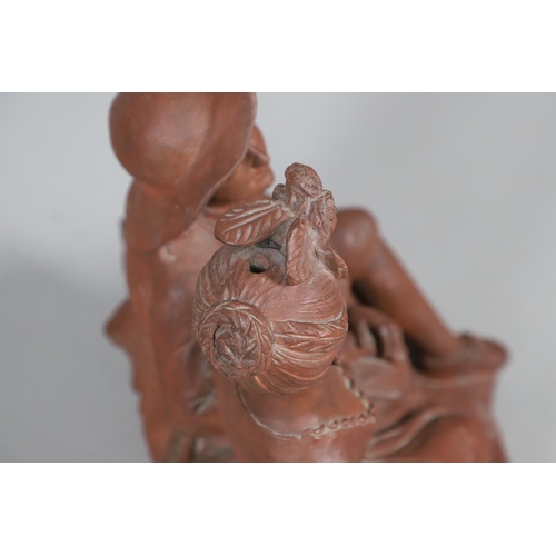 908 - A 19TH CENTURY FRENCH TERRACOTTA GROUP. modelled as a courting couple, seated upon naturalistic base... 