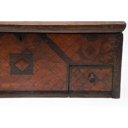 911 - AN ANTIQUE CONTINENTAL PARQUETRY BOX. the hinged lid enclosing a fleur de lys patterned paper lined ... 
