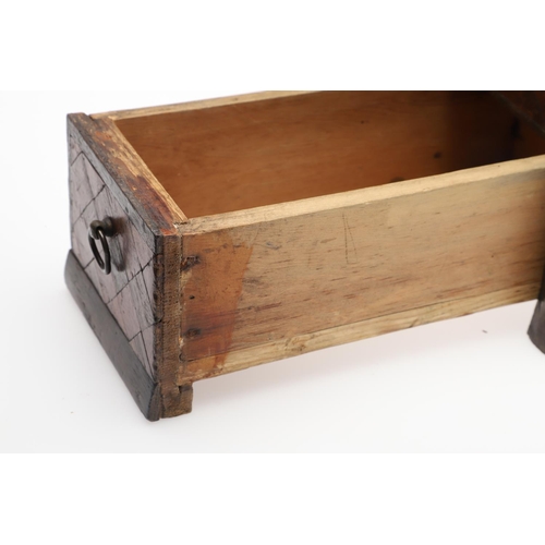 911 - AN ANTIQUE CONTINENTAL PARQUETRY BOX. the hinged lid enclosing a fleur de lys patterned paper lined ... 