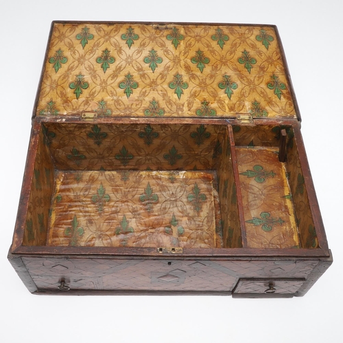 911 - AN ANTIQUE CONTINENTAL PARQUETRY BOX. the hinged lid enclosing a fleur de lys patterned paper lined ... 