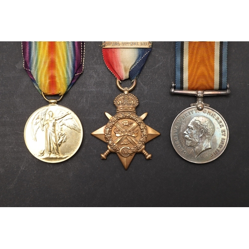 1245 - A 1914 TRIO TO A CASUALTY WITH THE WELSH REGIMENT. A Great War Trio comprising 1914 Star with '5th A... 