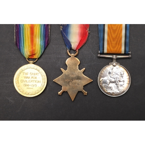 1245 - A 1914 TRIO TO A CASUALTY WITH THE WELSH REGIMENT. A Great War Trio comprising 1914 Star with '5th A... 