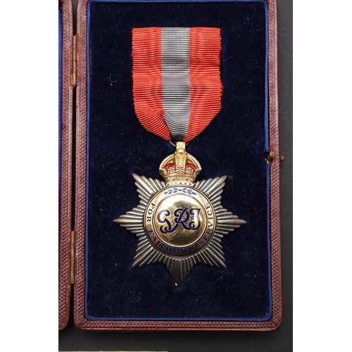 1008 - A GEORGE V IMPERIAL SERVICE ORDER. An Imperial Service Order on pin-backed red and blue ribbon, hall... 