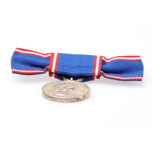 1011 - AN ELIZABETH II ROYAL VICTORIAN MEDAL. A Royal Victorian Order, 2nd type Elizabeth II issue on lady'... 