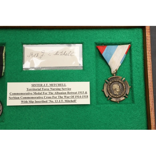 1021 - TWO TERRITORIAL NURSING SERVICES MEDALS ATTRIBUTED TO SISTER J.T. MITCHELL. A Commemorative Medal fo... 