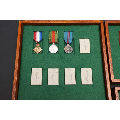 1025 - A COLLECTION OF MINIATURE MEDALS TO INCLUDE A MILITARY CROSS TRIO. A collection of miniature medals:... 