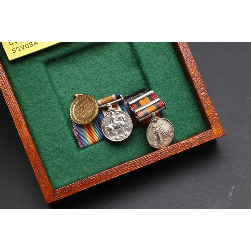 1025 - A COLLECTION OF MINIATURE MEDALS TO INCLUDE A MILITARY CROSS TRIO. A collection of miniature medals:... 