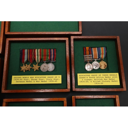 1025 - A COLLECTION OF MINIATURE MEDALS TO INCLUDE A MILITARY CROSS TRIO. A collection of miniature medals:... 