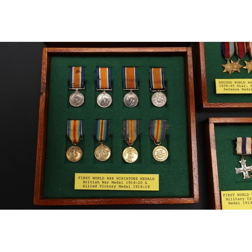 1025 - A COLLECTION OF MINIATURE MEDALS TO INCLUDE A MILITARY CROSS TRIO. A collection of miniature medals:... 