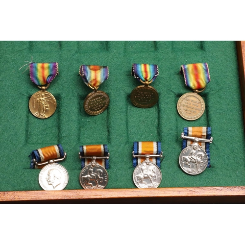 1025 - A COLLECTION OF MINIATURE MEDALS TO INCLUDE A MILITARY CROSS TRIO. A collection of miniature medals:... 