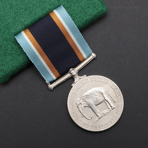 1031 - A CEYLON GEORGE VI POLICE LONG SERVICE AND GOOD CONDUCT MEDAL. A Police Long Service and Good Conduc... 