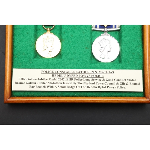 1035 - A PAIR OF MEDALS TO POLICE CONSTABLE KATHLEEN MATHIAS OF DYFED POWYS POLICE. A pair comprising Eliza... 