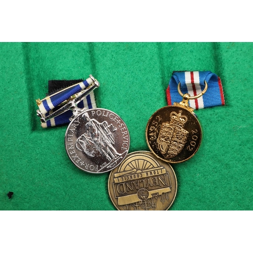 1035 - A PAIR OF MEDALS TO POLICE CONSTABLE KATHLEEN MATHIAS OF DYFED POWYS POLICE. A pair comprising Eliza... 