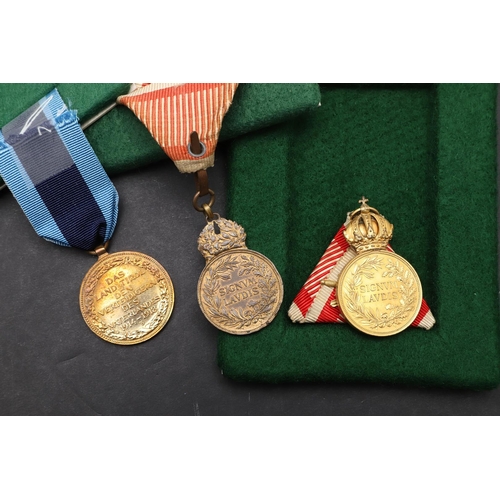 1041 - AUSTRIA: A COLLECTION OF FIVE AWARDS INCLUDING MEDALS OR MILITARY MERIT. A Medal for Military Merit,... 