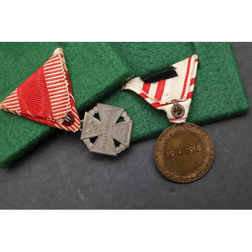 1041 - AUSTRIA: A COLLECTION OF FIVE AWARDS INCLUDING MEDALS OR MILITARY MERIT. A Medal for Military Merit,... 