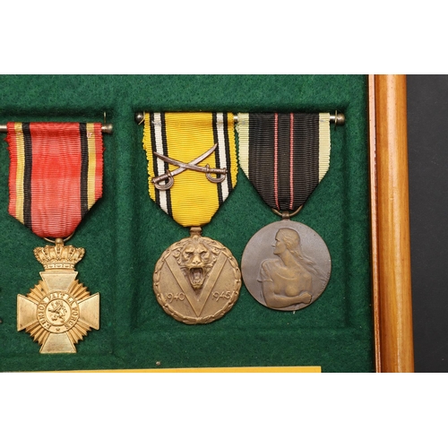 1056 - BELGIUM: TWO PAIRS OF SECOND WORLD WAR ERA MEDALS. A pair of medals comprising Labour Decoration 1st... 