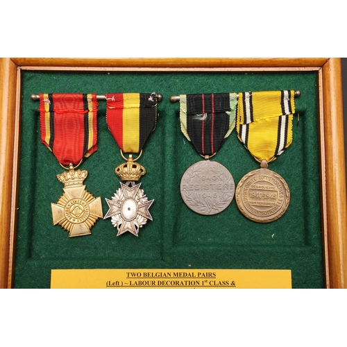 1056 - BELGIUM: TWO PAIRS OF SECOND WORLD WAR ERA MEDALS. A pair of medals comprising Labour Decoration 1st... 