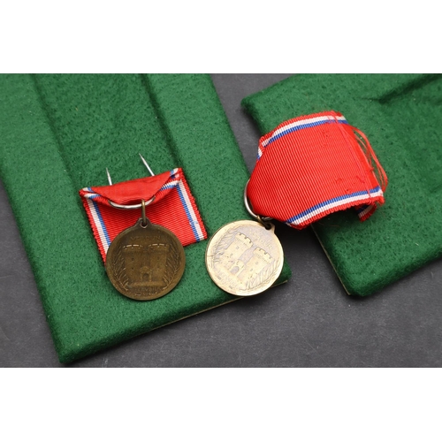 1083 - FRANCE: FOUR MEDALS FOR VERDUN. A Verdun medal with 'Verdun 21 Fevrier 1916' clasp and sewn four lea... 