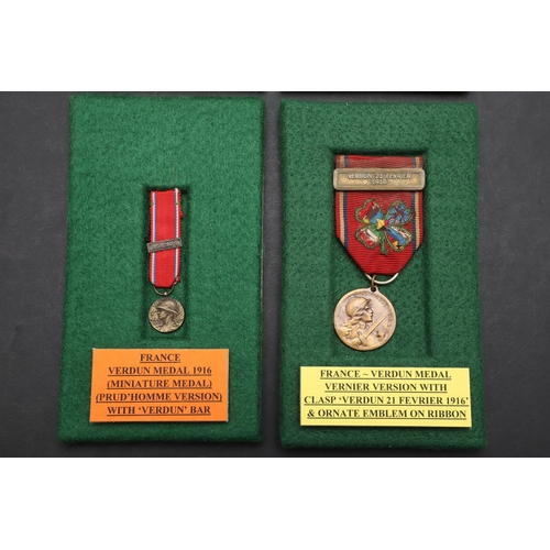 1083 - FRANCE: FOUR MEDALS FOR VERDUN. A Verdun medal with 'Verdun 21 Fevrier 1916' clasp and sewn four lea... 