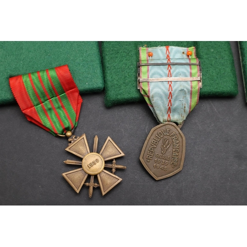 1084 - FRANCE: THREE CROIX DE GUERRE 1939-45 AND OTHERS SIMILAR. A Croix de Guerre dated 1939 and two dated... 