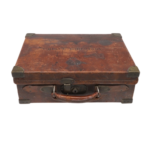 A LEATHER CARTRIDGE CASE BY HENRY ATKIN LTD OF LONDON. An oak lined