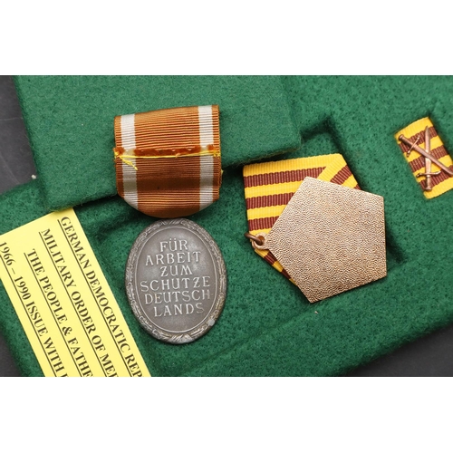 1141 - GERMANY: A COLLECTION OF SECOND WORLD WAR AND LATER MEDALS. A Second World War German War Merit Meda... 