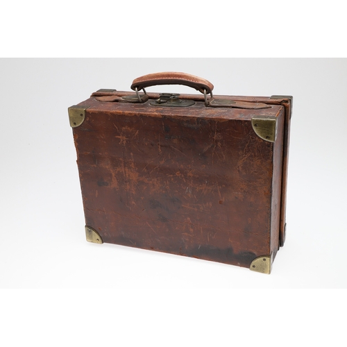 A LEATHER CARTRIDGE CASE BY HENRY ATKIN LTD OF LONDON. An oak lined