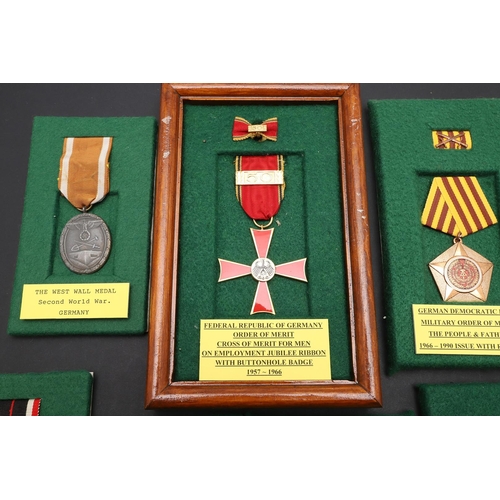 1141 - GERMANY: A COLLECTION OF SECOND WORLD WAR AND LATER MEDALS. A Second World War German War Merit Meda... 