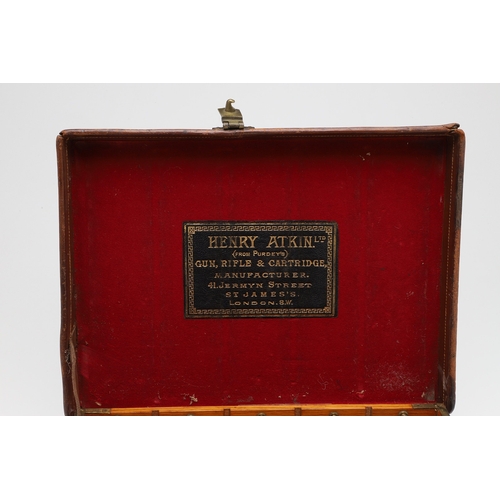 A LEATHER CARTRIDGE CASE BY HENRY ATKIN LTD OF LONDON. An oak lined