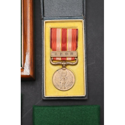 1159 - JAPAN: A COLLECTION OF SIX MEDALS INCLUDING A WOUND BADGE. A Japanese China incident Medal 1937-45 i... 