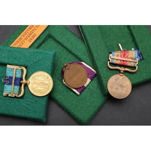 1159 - JAPAN: A COLLECTION OF SIX MEDALS INCLUDING A WOUND BADGE. A Japanese China incident Medal 1937-45 i... 