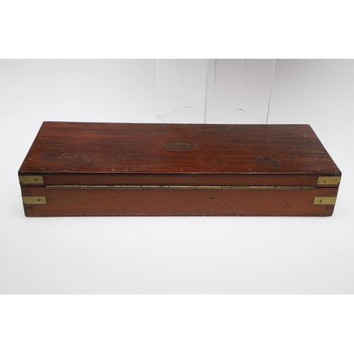62 - TWO PISTOL BOXES, BOTH WITH VACANT INTERIORS. An oak pistol box, rectangular with a central brass di... 