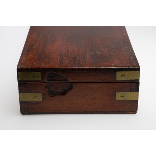 62 - TWO PISTOL BOXES, BOTH WITH VACANT INTERIORS. An oak pistol box, rectangular with a central brass di... 