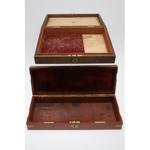 62 - TWO PISTOL BOXES, BOTH WITH VACANT INTERIORS. An oak pistol box, rectangular with a central brass di... 