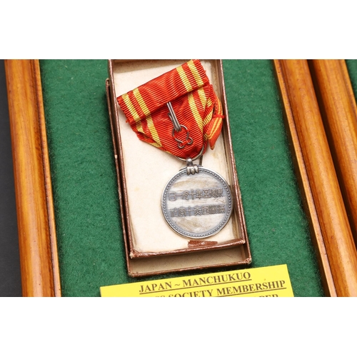 1163 - JAPAN: A COLLECTION OF JAPANESE RED CROSS SOCIETY MEDALS. A Japanese Red Cross Society Life Member M... 