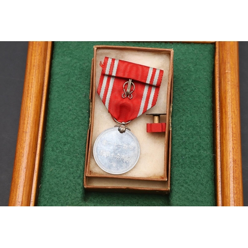 1163 - JAPAN: A COLLECTION OF JAPANESE RED CROSS SOCIETY MEDALS. A Japanese Red Cross Society Life Member M... 