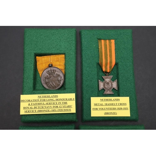 1166 - NETHERLANDS: FOUR MEDALS INCLUDING AN OFFICERS LONG SERVICE AWARD. Netherlands decoration for long, ... 