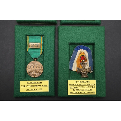 1166 - NETHERLANDS: FOUR MEDALS INCLUDING AN OFFICERS LONG SERVICE AWARD. Netherlands decoration for long, ... 