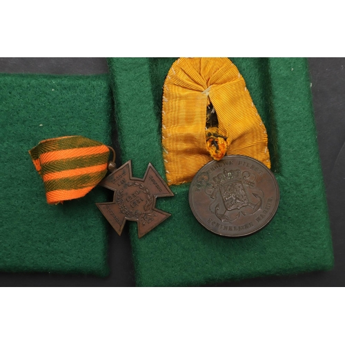 1166 - NETHERLANDS: FOUR MEDALS INCLUDING AN OFFICERS LONG SERVICE AWARD. Netherlands decoration for long, ... 