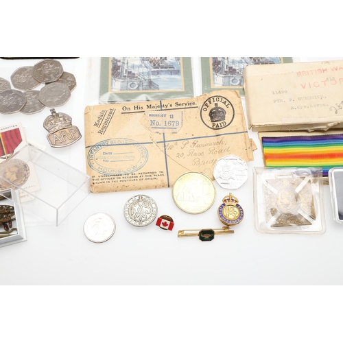 1203 - A COLLECTION OF MILITARIA AND LITERATURE TO INCLUDE BADGES AND BUTTONS. A collection of items includ... 