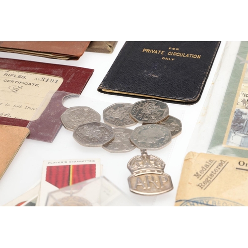 1203 - A COLLECTION OF MILITARIA AND LITERATURE TO INCLUDE BADGES AND BUTTONS. A collection of items includ... 