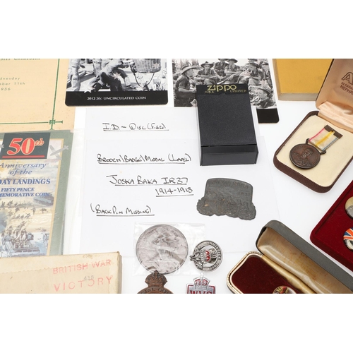 1203 - A COLLECTION OF MILITARIA AND LITERATURE TO INCLUDE BADGES AND BUTTONS. A collection of items includ... 