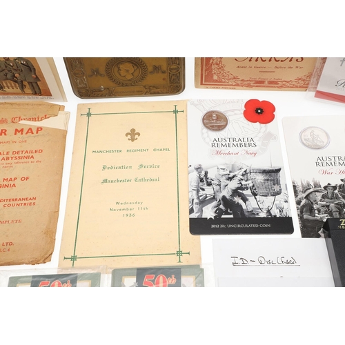 1203 - A COLLECTION OF MILITARIA AND LITERATURE TO INCLUDE BADGES AND BUTTONS. A collection of items includ... 