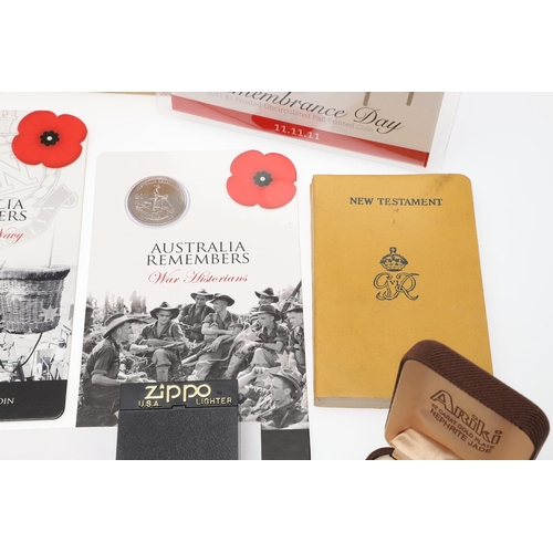 1203 - A COLLECTION OF MILITARIA AND LITERATURE TO INCLUDE BADGES AND BUTTONS. A collection of items includ... 