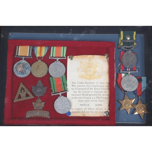 1232 - A COLLECTION OF FIRST AND SECOND WORLD WAR MEDALS TO THE WAKE FAMILY. A collection of medals, badges... 