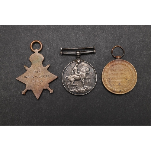 1238 - A FIRST WORLD WAR TRIO TO THE ROYAL FIELD ARTILLERY. A Great War trio named to 1526 Dvr H.M. Davies,... 