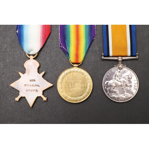 1242 - A FIRST WORLD WAR TRIO TO THE SUFFOLK REGIMENT. A Great War Trio comprising 1914 Star with clasp nam... 